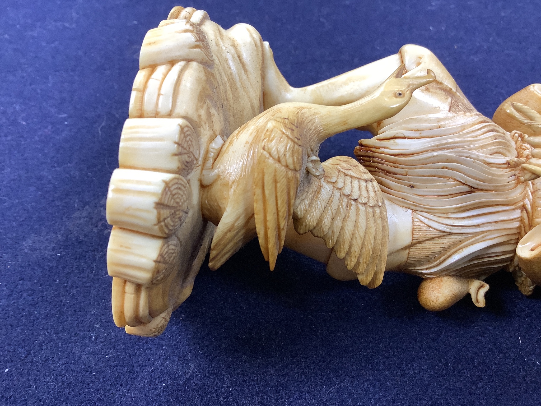 A Japanese ivory figure of a cormorant fisherman, early 20th century